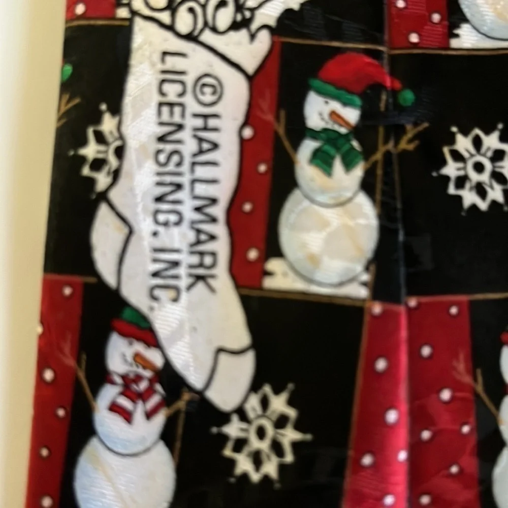 Hallmark Novelties men’s Christmas tie. Decorated with snowmen and Snowflakes.